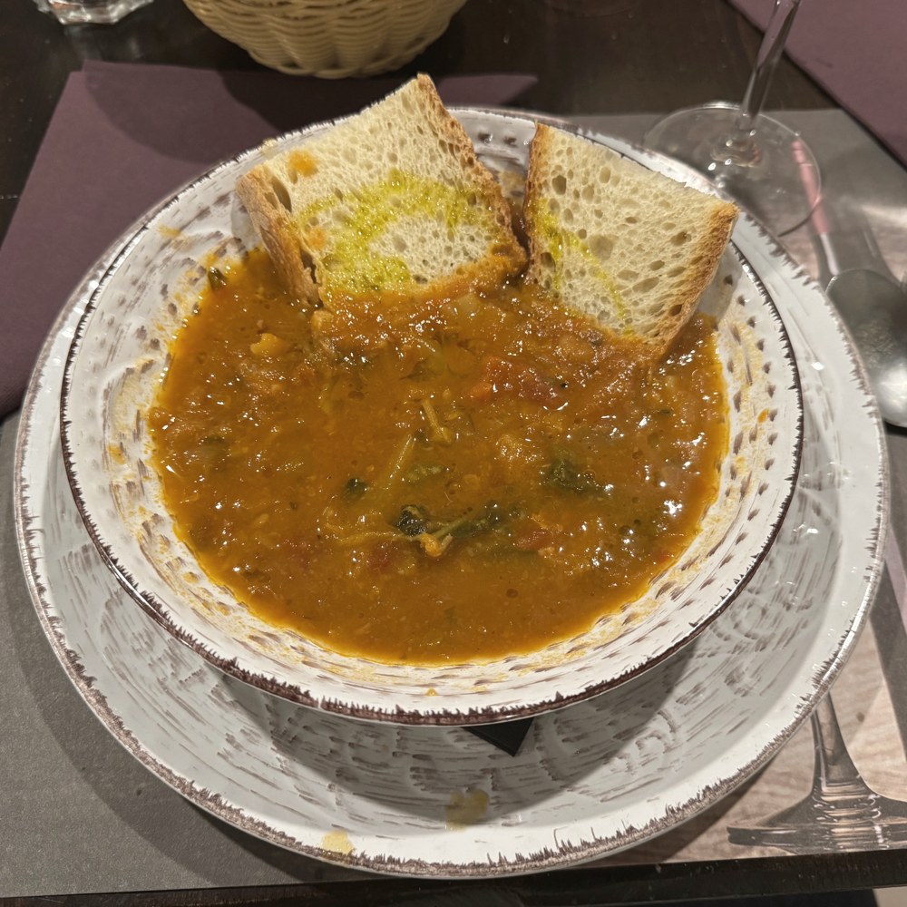 A bowl of ribollita on the table